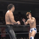 Nakamura (left) and Ibushi (right) size each other up during their match in the 2013 G1 Climax tournament